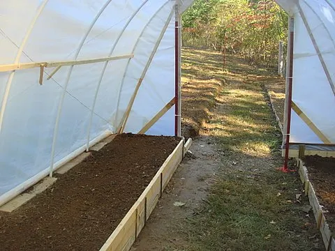 Raised beds in a hoop greenhouse